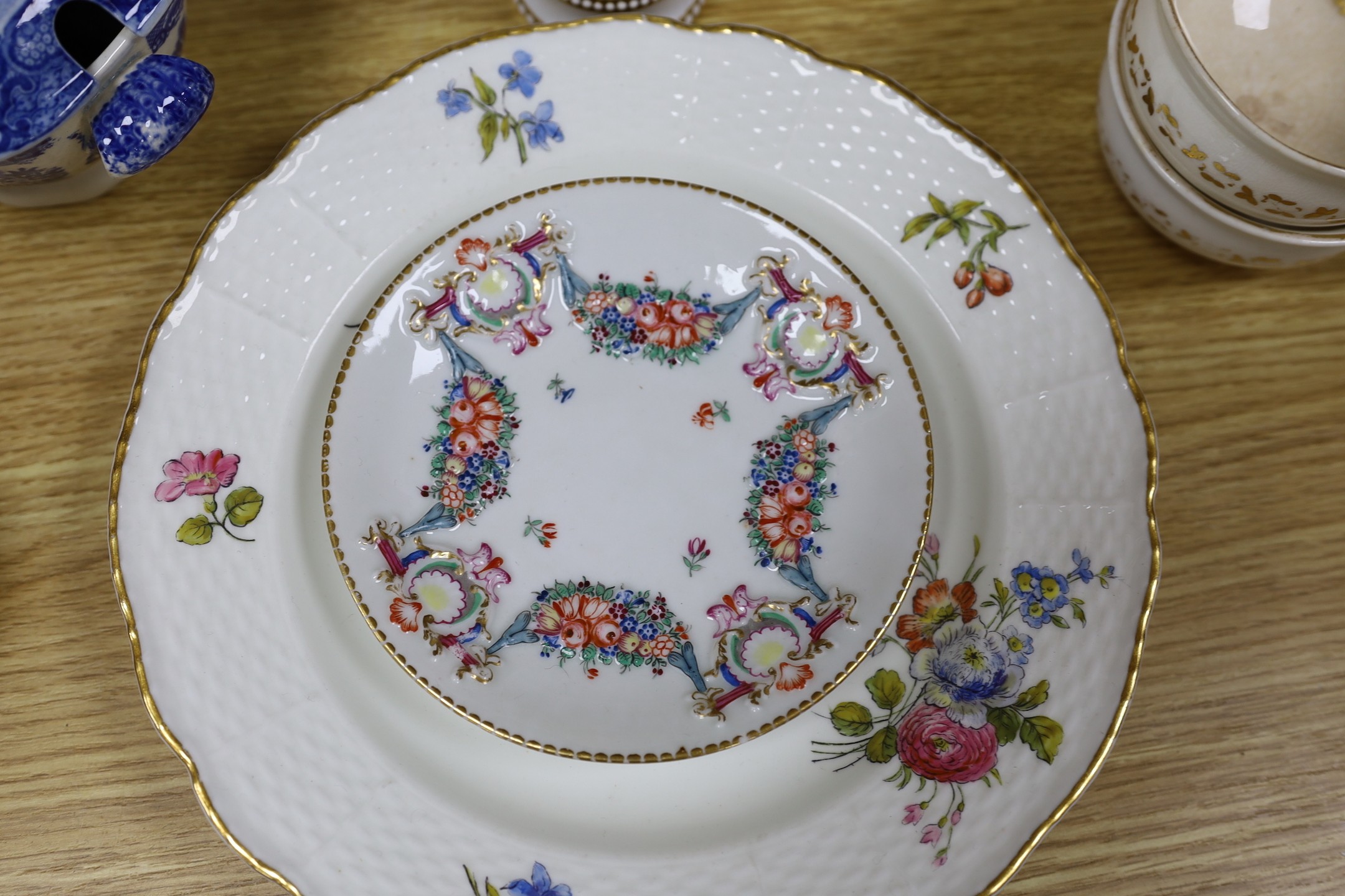 A group of Staffordshire blue and white pottery, including a sauce tureen and cover, together with a selection of decorative tea and dessert wares and ceramic centrepieces, one modelled as a cockerel